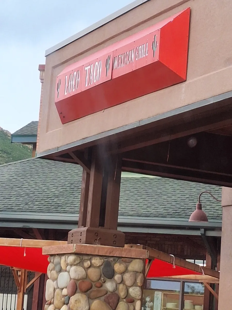 Red Loco Taco Mexican Grill sign on the building exterior above a stone-clad entrance